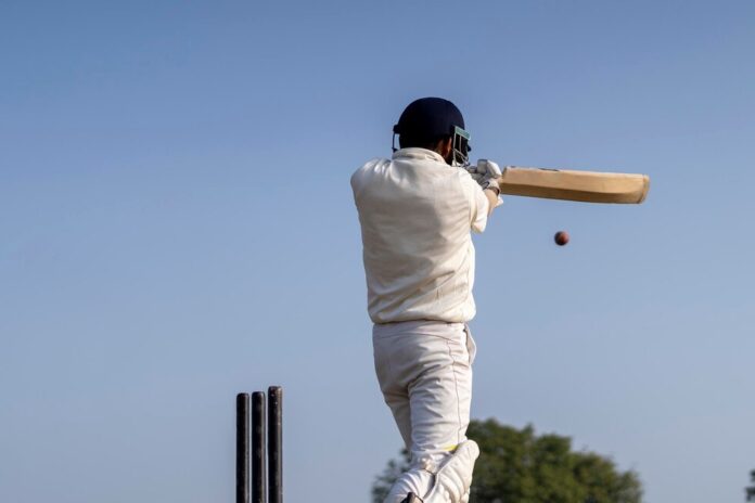 cricketer-playing-cricket-pitch-white-dress-test-matchessportsperson-hitting-shot_1048944-28774421