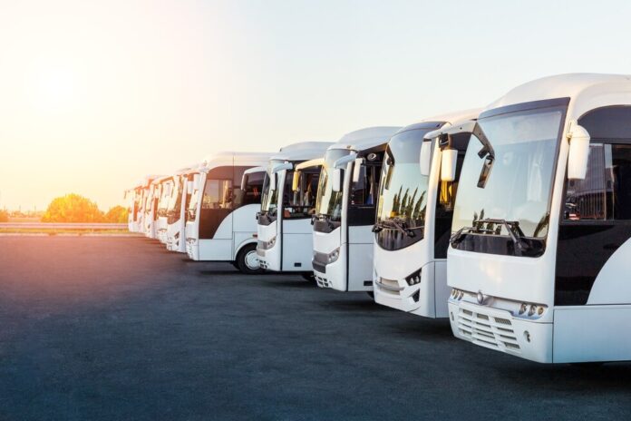 tourist-buses-parking-sunrise-sunset_106035-1198