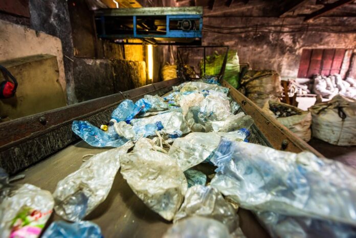 plastic-garbage-conveyor-belt-waste-recycling-factory_1268-23430