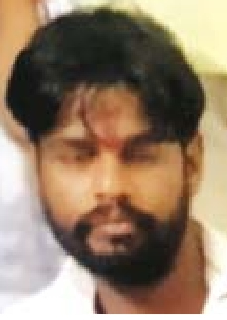 Blood-stained body of a young man found in a locked room in Ujjain; wife being questioned.