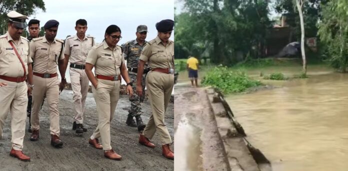 प्रशासनिक अधिकारी जलमग्न क्षेत्र का निरीक्षण करते हुए