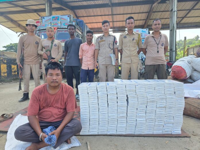 Image of the Arrested Accused with 50K Burmese Cigarettes Seized At Assam-Meghalaya Border.