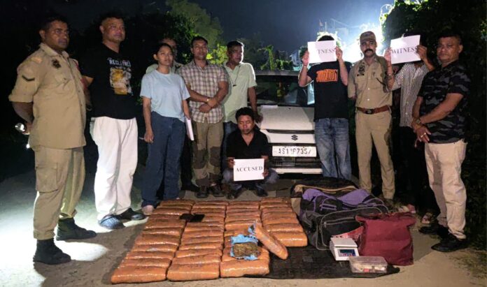 Image of the 61.937 Kg Suspected Ganja Seized in Assam and Arrested Accused.